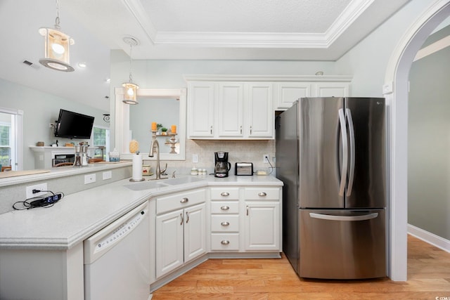 180 Waterhall Dr, Murrells Inlet, SC 29576 - kitchen featuring freestanding refrigerator, white dishwasher, a sink, light countertops, and light wood-style flooring