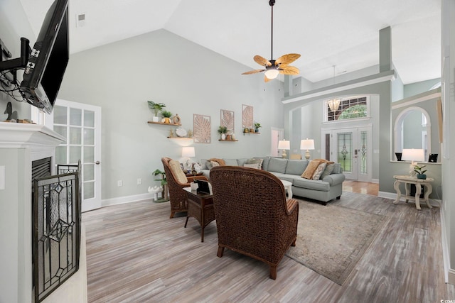 180 Waterhall Dr, Murrells Inlet, SC 29576 - living area featuring ceiling fan, high vaulted ceiling, light wood-style flooring, baseboards, and a fireplace
