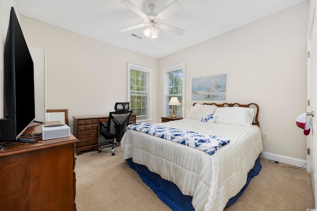 180 Waterhall Dr, Murrells Inlet, SC 29576 - bedroom with light colored carpet, an office area, baseboards, and a ceiling fan