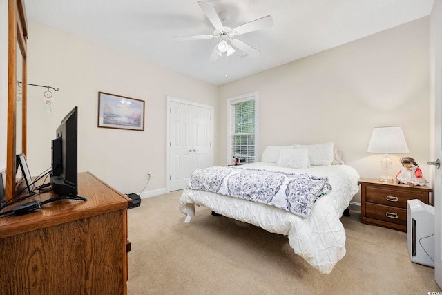 180 Waterhall Dr, Murrells Inlet, SC 29576 - bedroom with light colored carpet, baseboards, a closet, and ceiling fan