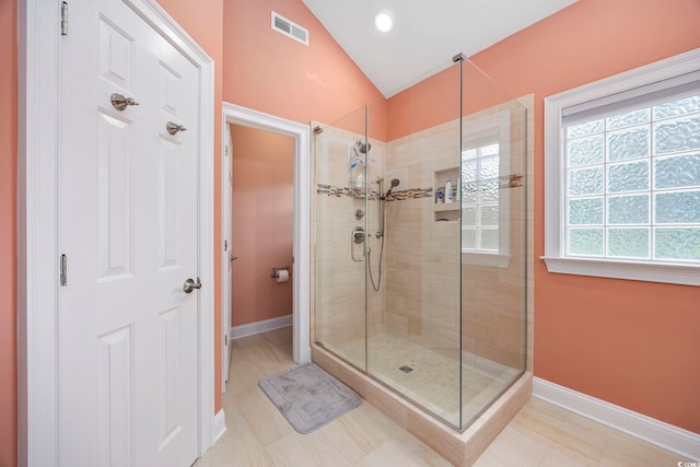 180 Waterhall Dr, Murrells Inlet, SC 29576 - full bathroom with a stall shower, lofted ceiling, and baseboards