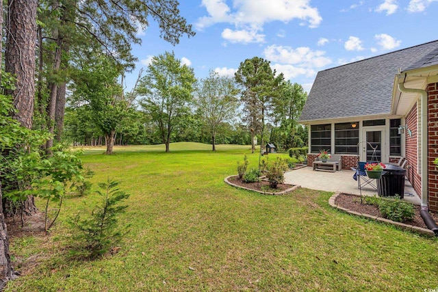 180 Waterhall Dr, Murrells Inlet, SC 29576 - view of grassy yard featuring a patio and a sunroom