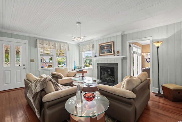 4003 N Ocean Blvd, Myrtle Beach, SC 29577 - living area featuring crown molding, a fireplace, and hardwood / wood-style floors