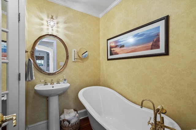 4003 N Ocean Blvd, Myrtle Beach, SC 29577 - full bathroom featuring ornamental molding and a freestanding tub