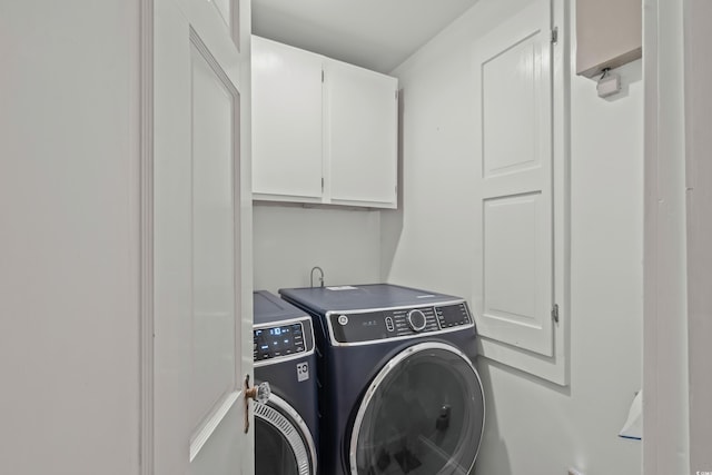 4003 N Ocean Blvd, Myrtle Beach, SC 29577 - clothes washing area with washing machine and clothes dryer and cabinet space