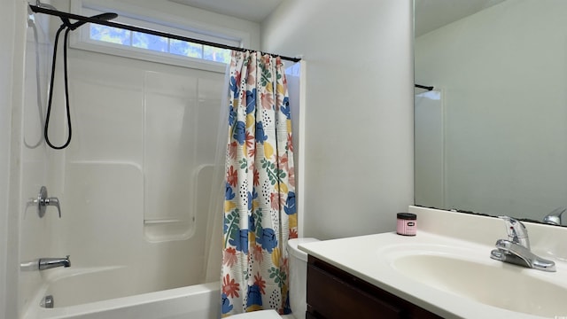bathroom with shower / tub combo with curtain, vanity, and toilet