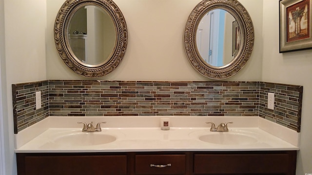 full bath with tasteful backsplash and double vanity