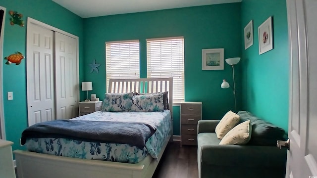 bedroom featuring a closet and dark wood-type flooring