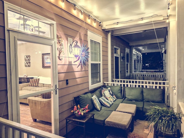 view of patio featuring an outdoor hangout area and a porch