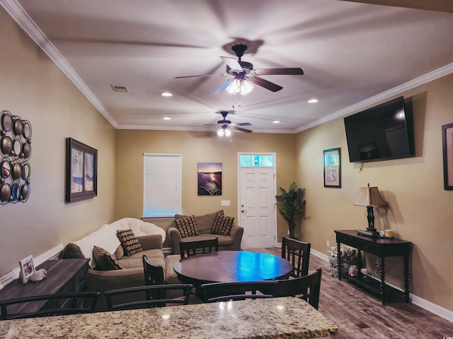 living area with dark wood finished floors, ceiling fan, recessed lighting, ornamental molding, and baseboards