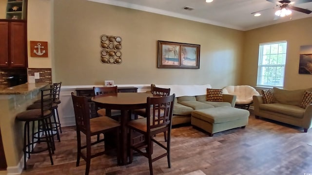 dining area with ceiling fan, crown molding, recessed lighting, and wood finished floors