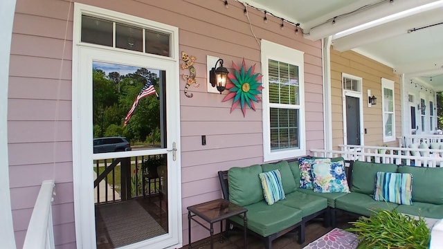 wooden terrace featuring covered porch
