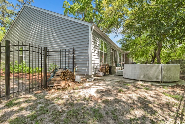 view of home's exterior featuring fence