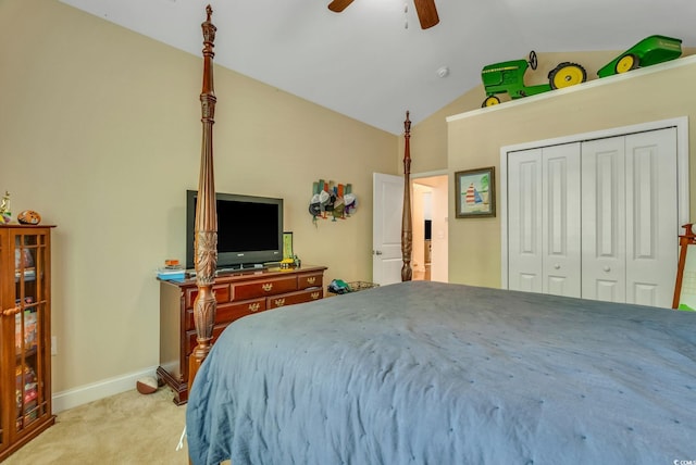bedroom with carpet floors, lofted ceiling, a closet, a ceiling fan, and baseboards