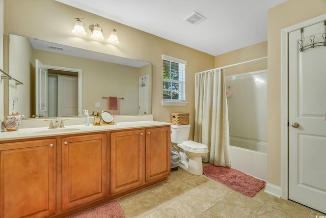 bathroom with vanity, shower / bath combo with shower curtain, and toilet