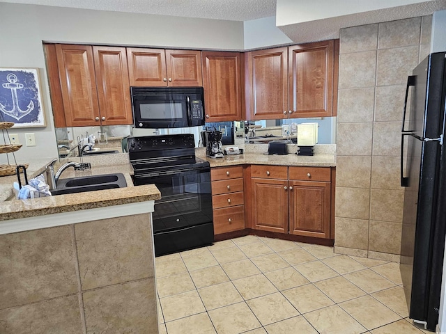 5300 N Ocean Blvd Unit 518, Myrtle Beach, SC 29577 - kitchen featuring black appliances, light tile patterned floors, brown cabinets, and a sink