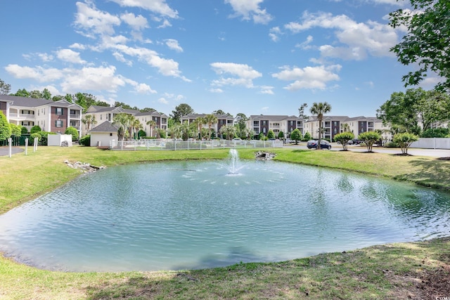 water view with nearby suburban area and fence