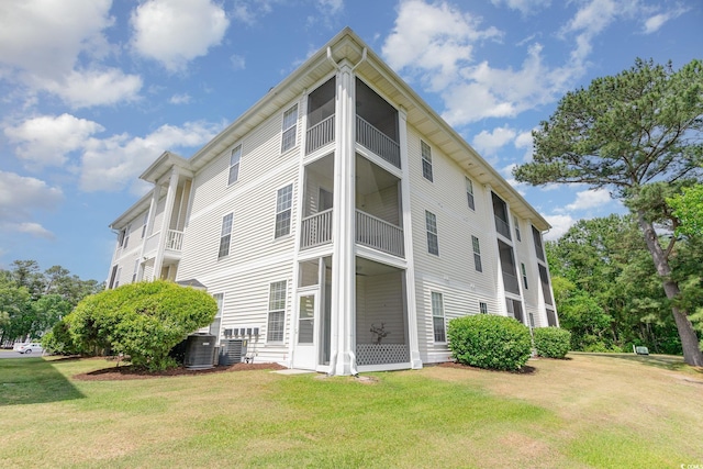 view of building exterior with central AC unit