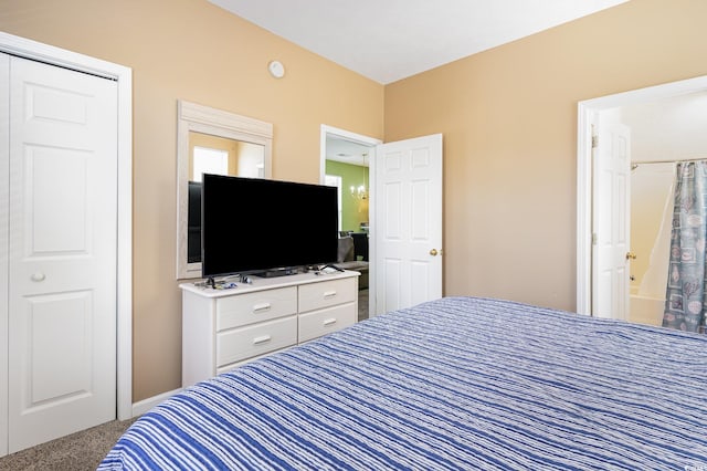 bedroom with carpet and ensuite bathroom
