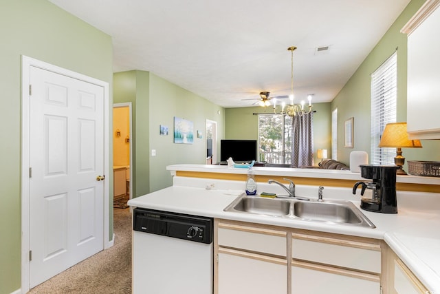 kitchen with dishwasher, carpet flooring, open floor plan, light countertops, and a sink