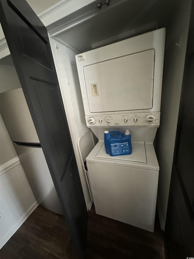 207 E Bobby Gerald Pkwy, Marion, SC 29571 - laundry area featuring stacked washer and clothes dryer and dark wood-type flooring