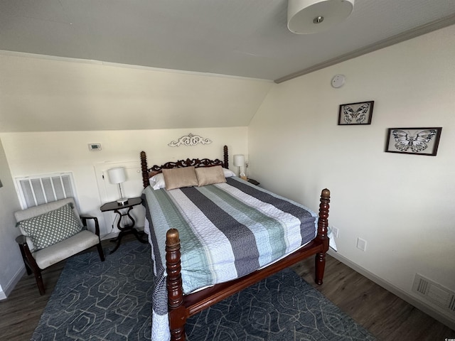 207 E Bobby Gerald Pkwy, Marion, SC 29571 - bedroom with lofted ceiling, wood finished floors, and baseboards
