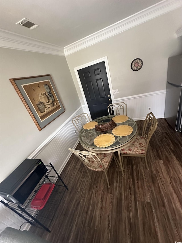207 E Bobby Gerald Pkwy, Marion, SC 29571 - dining room with wood finished floors, wainscoting, and crown molding