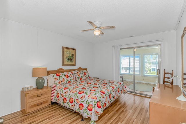 bedroom with light wood-style floors and a ceiling fan