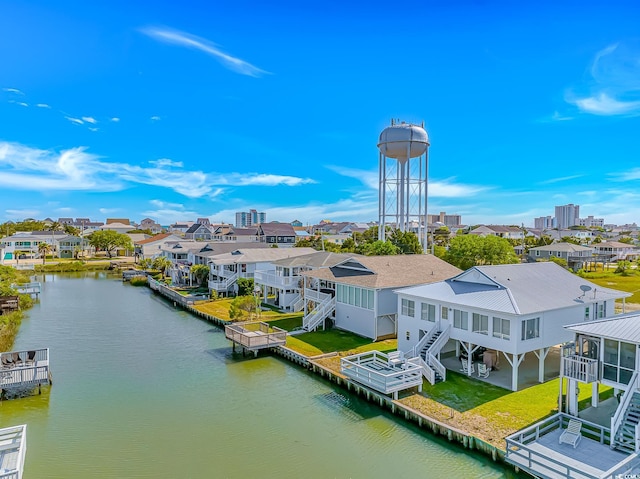 aerial perspective of suburban area with a large body of water