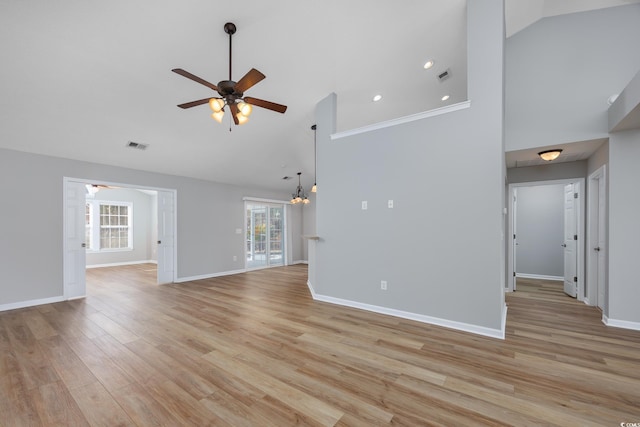 229 Duchess Ct, Myrtle Beach, SC 29588 - unfurnished living room with ceiling fan, high vaulted ceiling, light wood-style flooring, baseboards, and a chandelier