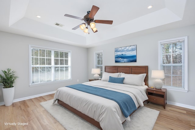 229 Duchess Ct, Myrtle Beach, SC 29588 - bedroom featuring a raised ceiling, light wood-style floors, and recessed lighting