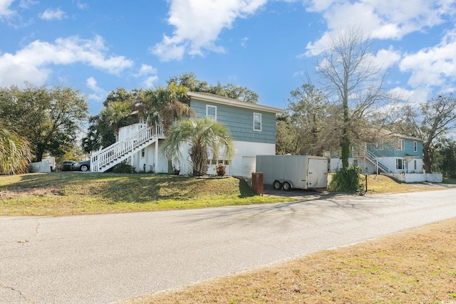 215 28th Ave S, Myrtle Beach, SC 29577 - view of front facade with stairs and a front yard