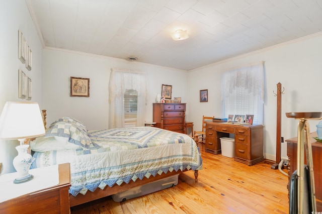 215 28th Ave S, Myrtle Beach, SC 29577 - bedroom with light wood-style flooring, ornamental molding, and multiple windows