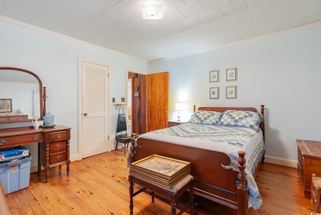 215 28th Ave S, Myrtle Beach, SC 29577 - bedroom with crown molding, light wood-style flooring, and baseboards