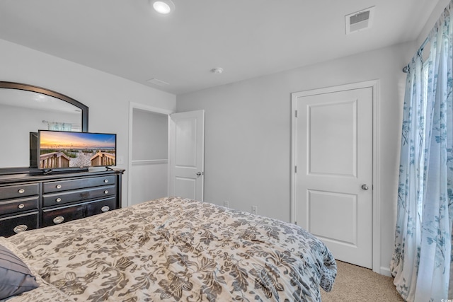 bedroom with carpet and baseboards