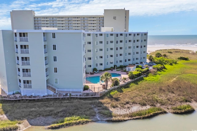 9400 Shore Dr Unit 206, Myrtle Beach, SC 29572 - drone / aerial view of a pool area, apartment complex / building, and a nearby body of water