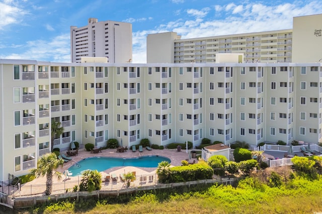 9400 Shore Dr Unit 206, Myrtle Beach, SC 29572 - view of apartment building / complex featuring a community pool and fence