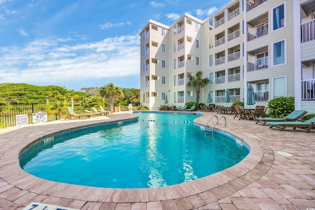 9400 Shore Dr Unit 206, Myrtle Beach, SC 29572 - community pool featuring fence and a patio area