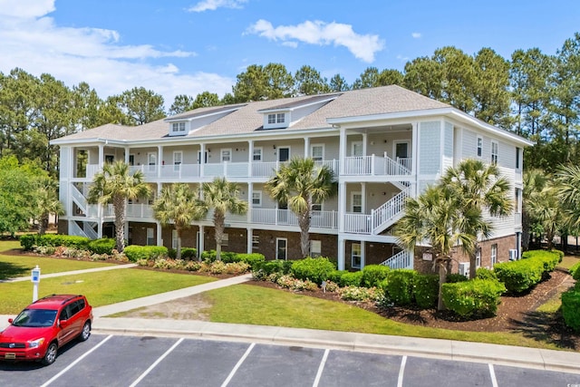 6253 Catalina Dr Unit 422, North Myrtle Beach, SC 29582 - view of building exterior featuring uncovered parking