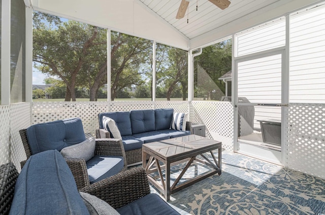 sunroom featuring an outdoor living space, ceiling fan, and vaulted ceiling