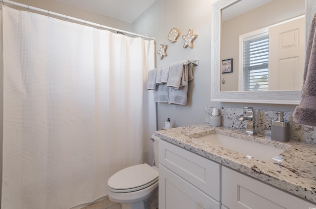 full bath featuring toilet and vanity