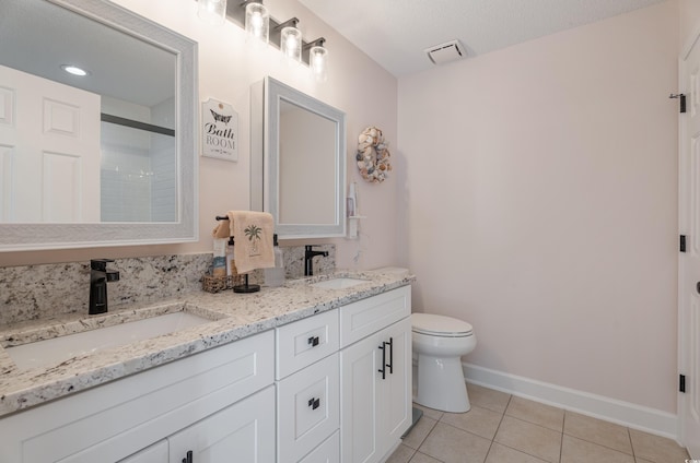 full bath with tile patterned floors, toilet, baseboards, double vanity, and a shower