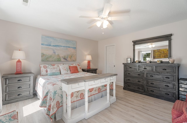bedroom featuring wood finished floors and ceiling fan