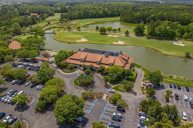 aerial overview of property's location featuring a large body of water and a golf club