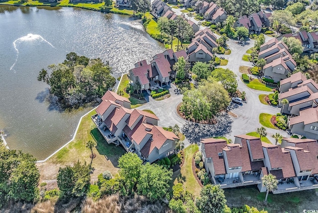 aerial overview of property's location with nearby suburban area and a large body of water