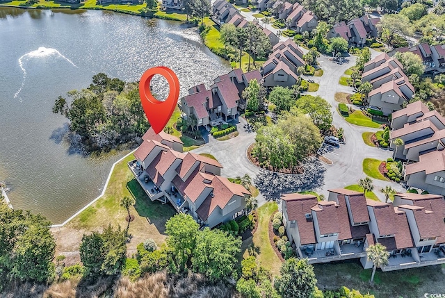 aerial overview of property's location with nearby suburban area and a nearby body of water
