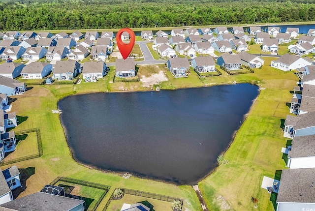 aerial perspective of suburban area featuring a large body of water