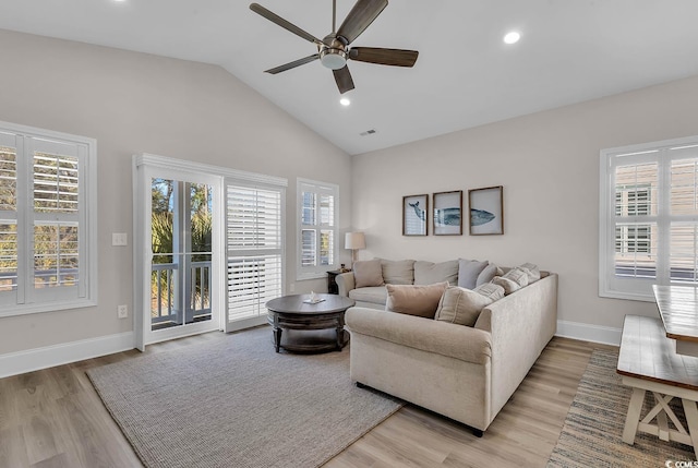living room with ceiling fan, light wood finished floors, recessed lighting, baseboards, and high vaulted ceiling