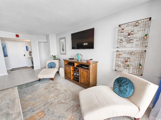 9650 Shore Dr Unit 1203, Myrtle Beach, SC 29572 - tiled living area featuring a textured ceiling and baseboards