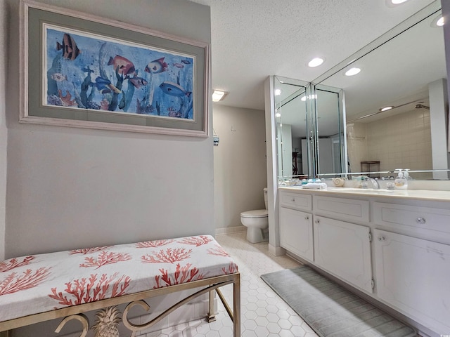9650 Shore Dr Unit 1203, Myrtle Beach, SC 29572 - full bathroom featuring toilet, vanity, recessed lighting, tile patterned floors, and a textured ceiling